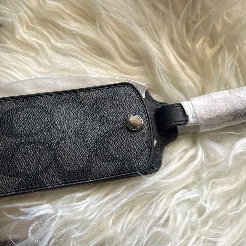 Coach luggage tag. Grey and black signature
